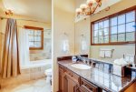 Bathroom with granite countertop vanity